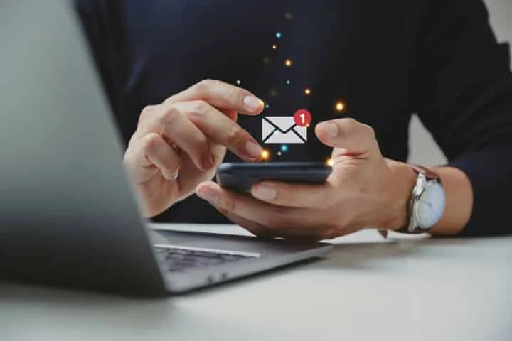 Hand Of Businessman Using Smartphone For Email With Notification